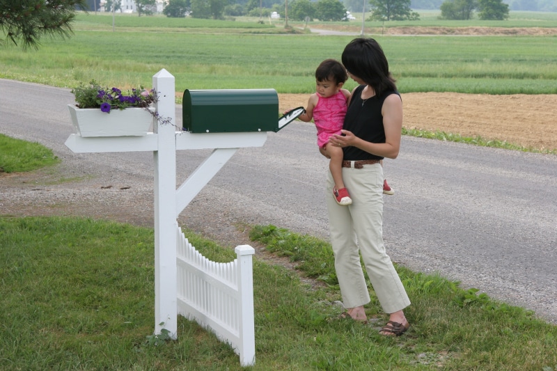 sister, outdoors, gate, two people, picket, females, alloy wheel, women, innocence, bonding, adventure, public mailbox, child, spoke, plant, full length
