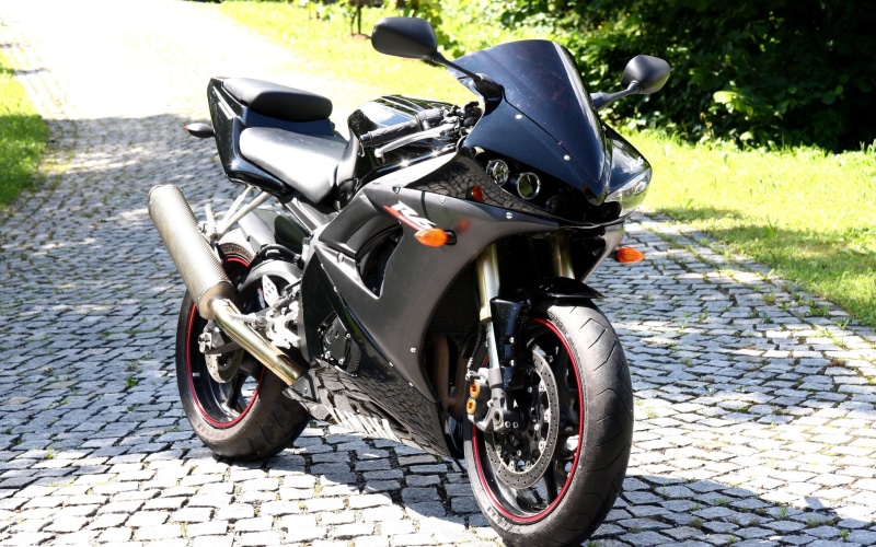 Yamaha R6, mode of transportation, parking, sunlight, paving stone, motorcycle, bicycle, shadow, day, cobblestone, transportation, city, no people, stationary