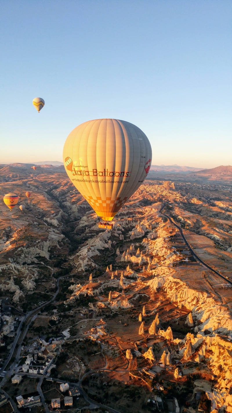outdoors, air vehicle, turkey, transportation, ballooning, 4K, mid-air, landscape, balloon, travel destinations, rock - object, mode of transportation