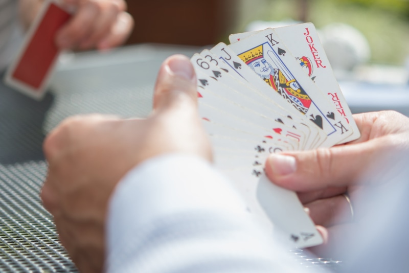 adult, club, relaxation, person, holding, table, suit, vegas, chance, indoors, red, play, gambling, poker, 2K, win, close-up, risk, betting, bet, poker - card game