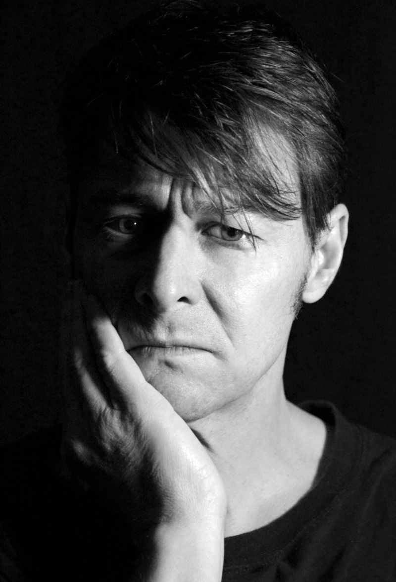 depression, adults only, real people, serious, black background, sculpture, adult, man, men, portrait, human body part, looking at camera, close-up, human face