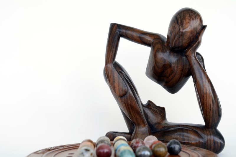 white background, statue, solitaire, holzfigur, consider, food, animal, hermit game, sad, patience, logically, basket, play, rates, container, studio shot