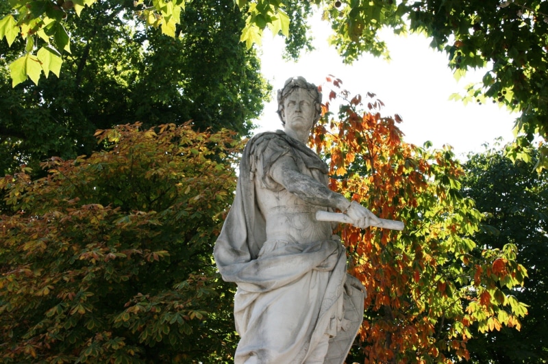 craft, religion, angel, male likeness, belief, nature, sculpture, tree, green color, garden of tuilleries, low angle view, female likeness, representation