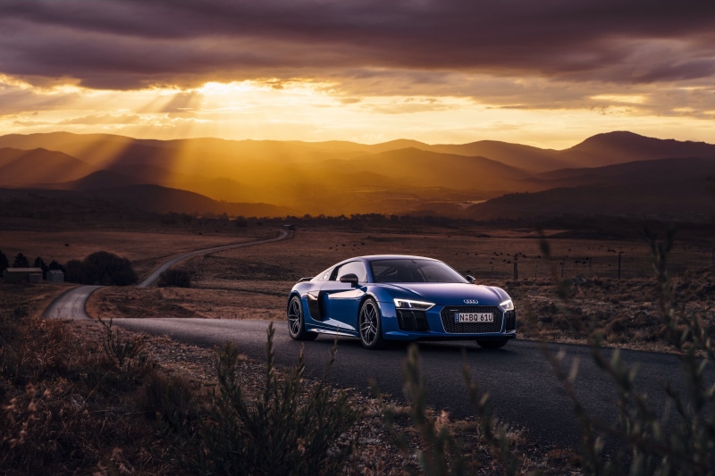 field, r, mountain, motor vehicle, driving, sun, transportation, car, outdoors, no People, scenics, sky, nature, environment, mountain peak, audi, landscape