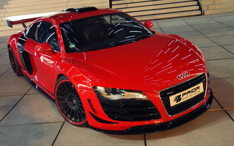 focus on foreground, high angle view, flooring, garage, day, motor vehicle, shopping, Audi R8, text, close-up, car, transportation, number, red, no people