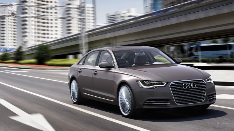 motion, audi, silver colored, land vehicle, street, building, outdoors, no people, sedan, motor vehicle, office building exterior, mode of transportation