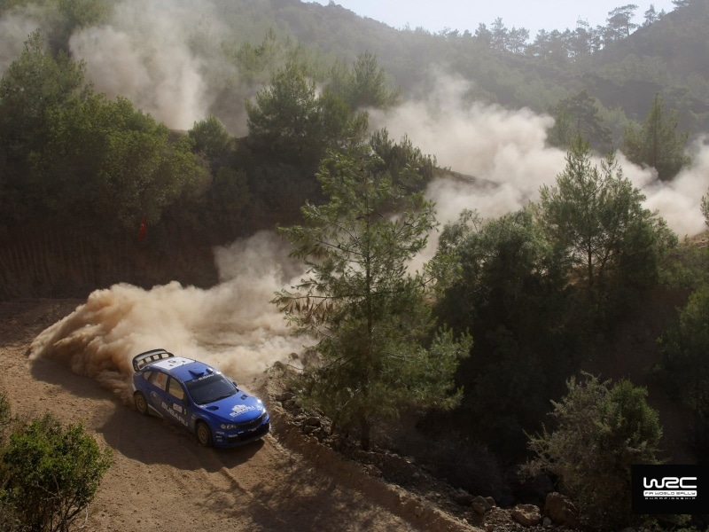 road, tree, high angle view, land vehicle, sports, car, pollution, mode of transportation, no people, travel, rally, motor vehicle, dust, smoke - physical structure