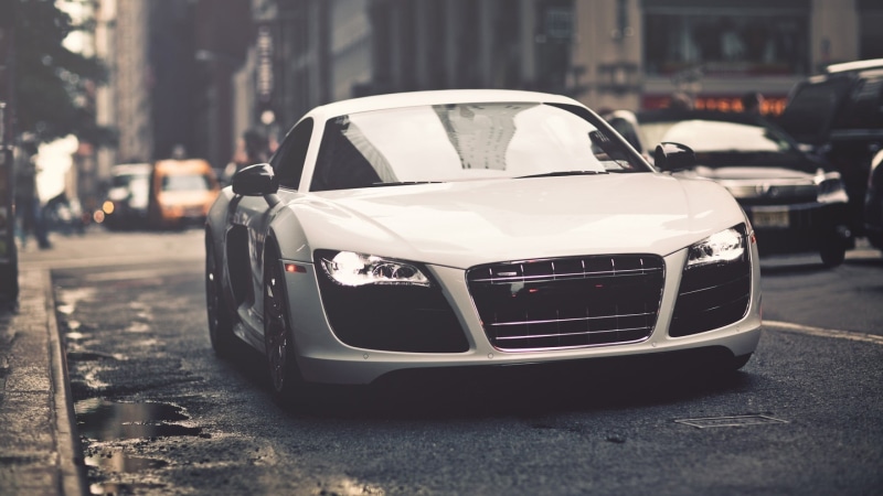 outdoors, transportation, elegance, building exterior, focus on foreground, coupe, built structure, technology, power, business, retro styled, engine, urban Scene