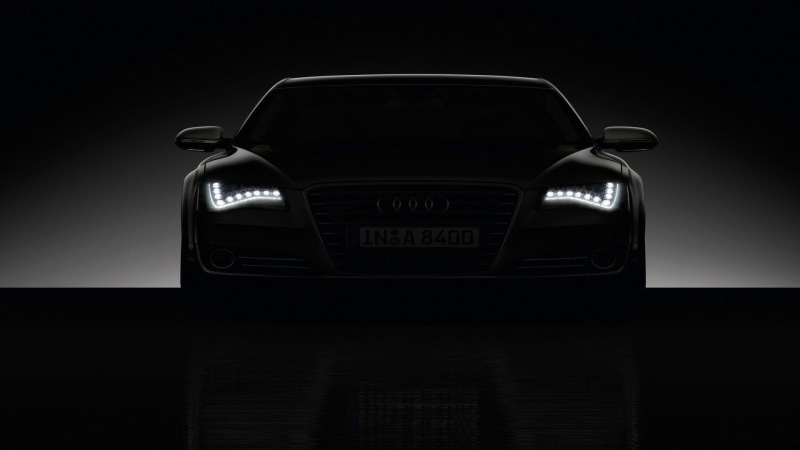 black background, Audi, land vehicle, dark, motor vehicle, ornate, reflection, close-up, retro styled, no people, r, text, night, shiny, illuminated, still life