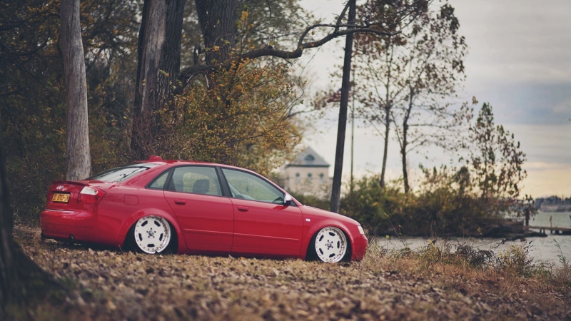 motor vehicle, focus on foreground, Audi, field, nature, red, road, trunk, land, car, plant, outdoors, day, land vehicle, tree, no people, 1080P, mode of transportation