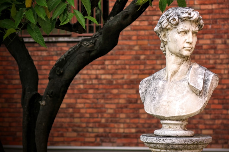 headbust, brick, 4K, tree, red, wall - building feature, building exterior, roman, sculpture, creativity, outdoors, near, religion, architecture, gray