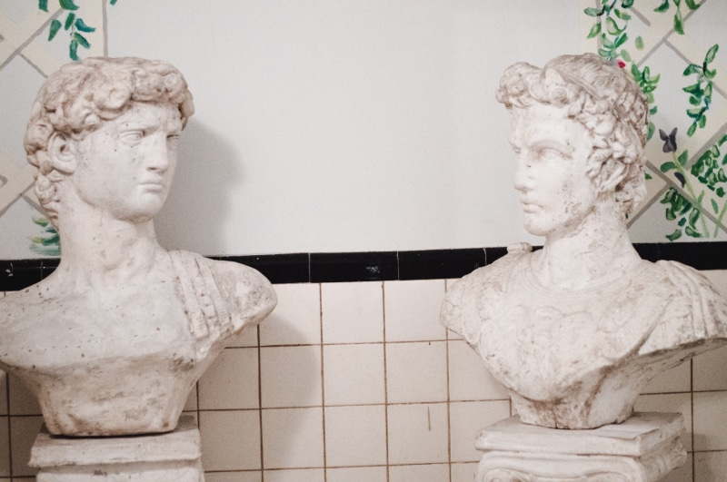male likeness, headbusts, beside, human representation, two, 5K, male, carving - craft product, wall - building feature, wall, sculpture, indoors, craft