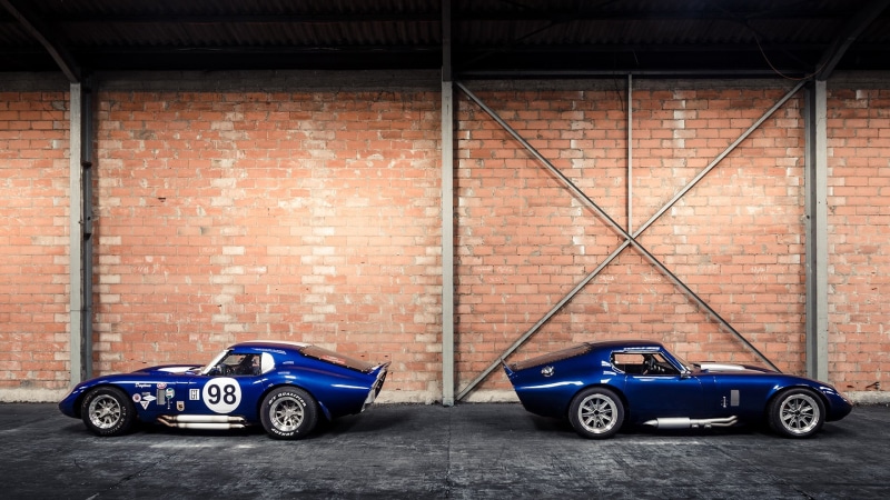 mode of transportation, architecture, boundary, fence, motor vehicle, blue, building exterior, wall - building feature, sport, garage, transportation, land vehicle