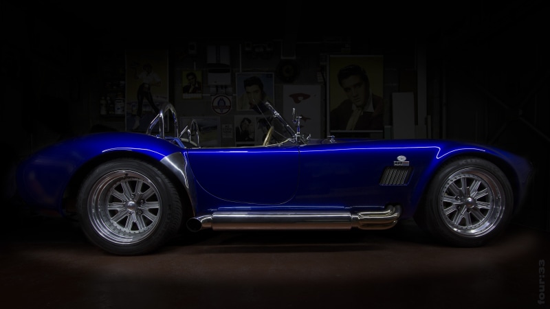 tire, wheel, no people, Shelby, shiny, convertible, motor vehicle, blue cars, indoors, sports car, metal, luxury, dark, studio shot, land vehicle, garage