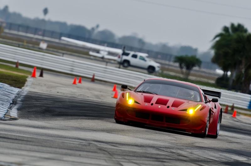 Ferrari 458, mode of transportation, land vehicle, no people, illuminated, part, street, day, motor vehicle, black, motion, outdoors, sky, transportation