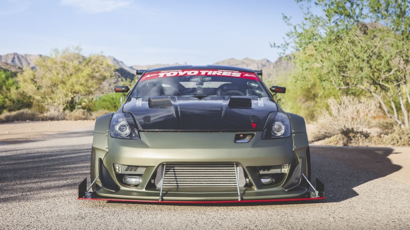motor vehicle, stationary, 350z, day, mode of transportation, outdoors, plant, retro styled, nature, land vehicle, transportation, Nissan, tree, shadow
