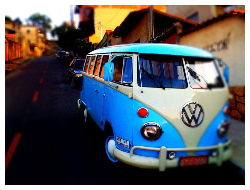 car, city, mode of transportation, blue, focus on foreground, built structure, van, architecture, adventure, travel, road, kombi, street, transportation