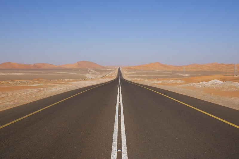 tranquil scene, road marking, bed, marking, arid climate, transportation, mattress, dividing line, sky, 2K, road, white, mountain range, straight, the way forward