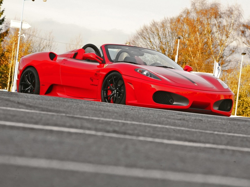 motor vehicle, luxury, competition, land vehicle, sign, day, road, nature, frame, Ferrari, car, transportation, sports car, 1080P, black, no people, mode of transportation