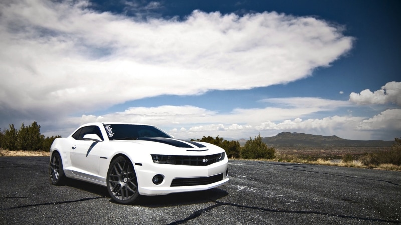 cloud - sky, environment, land vehicle, sky, road, driving, motor vehicle, day, car, journey, luxury, mode of transportation, chevrolet camaro bumblebee