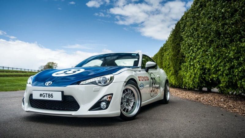 motor vehicle, day, retro styled, outdoors, land vehicle, 720P, transportation, car, sky, no people, plant, green color, tree, nature, sunlight, Toyota GT86