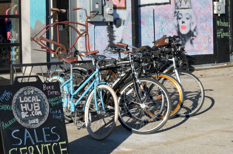 wheel, bicycle, day, vintage, street, retro, city, travel, building exterior, sunlight, bicycles, bicycling, land vehicle, parking, outdoors, selling, nature