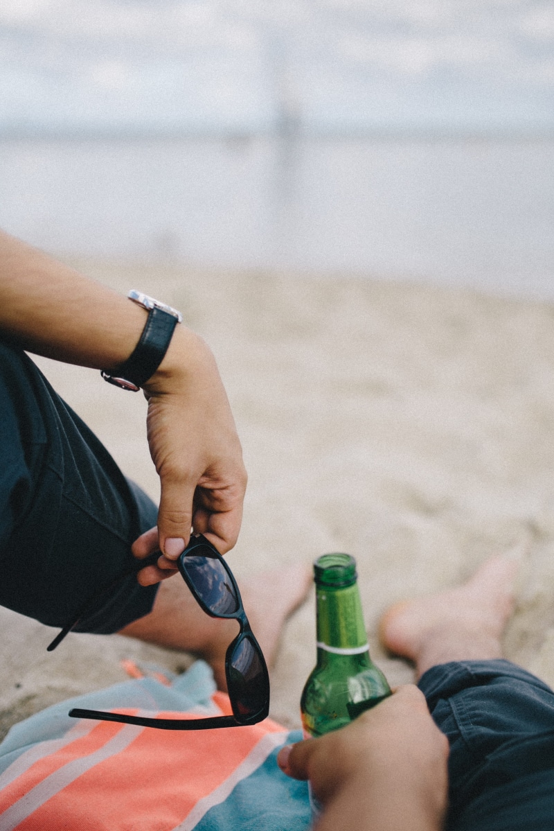 vacations, sand, adult, summer, beer, holidays, shorts, personal perspective, human Hand, 2K, low section, finger, male, two people, beach, holding, human limb