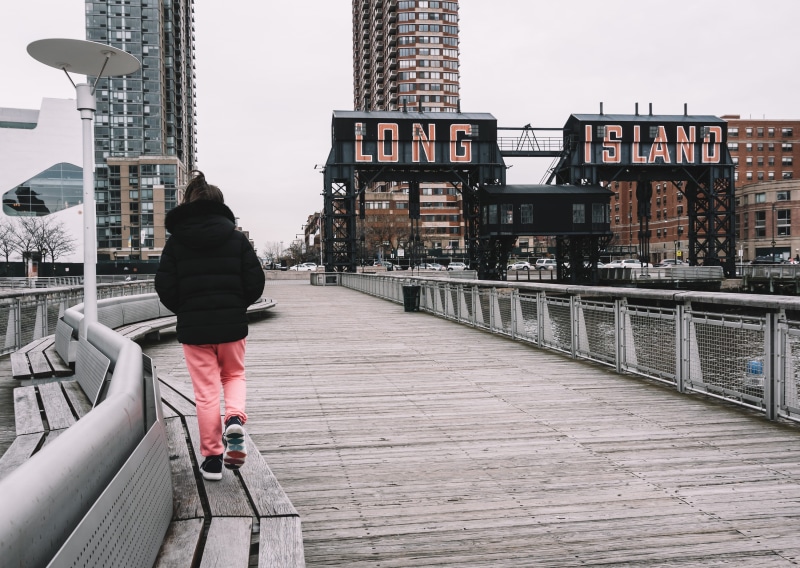 dock, apparel, day, person, girl, bridge, banister, building exterior, full length, clothing, railing, human, built structure, path, architecture, bench