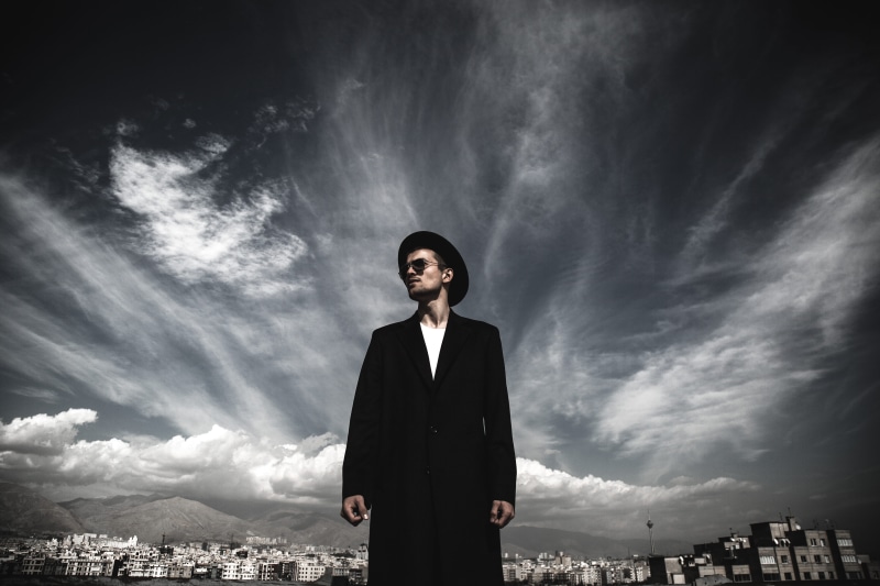highway, looking at camera, wearing, cloudy, young men, trench coat, young adult, road, front view, portrait, architecture, men, lifestyles, way, clothing