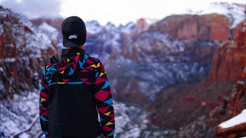 person, helmet, adult, rock - object, 5K, zion, nature, standing, looking at view, focus on foreground, waist up, covered, photo, man, cold temperature