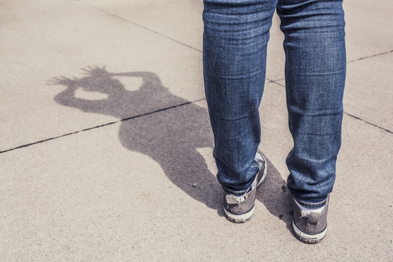 outdoors, low section, casual clothing, street, blue jeans, s, one person, human body part, sneakers, sunlight, women, body part, limb, shoe, whimsical