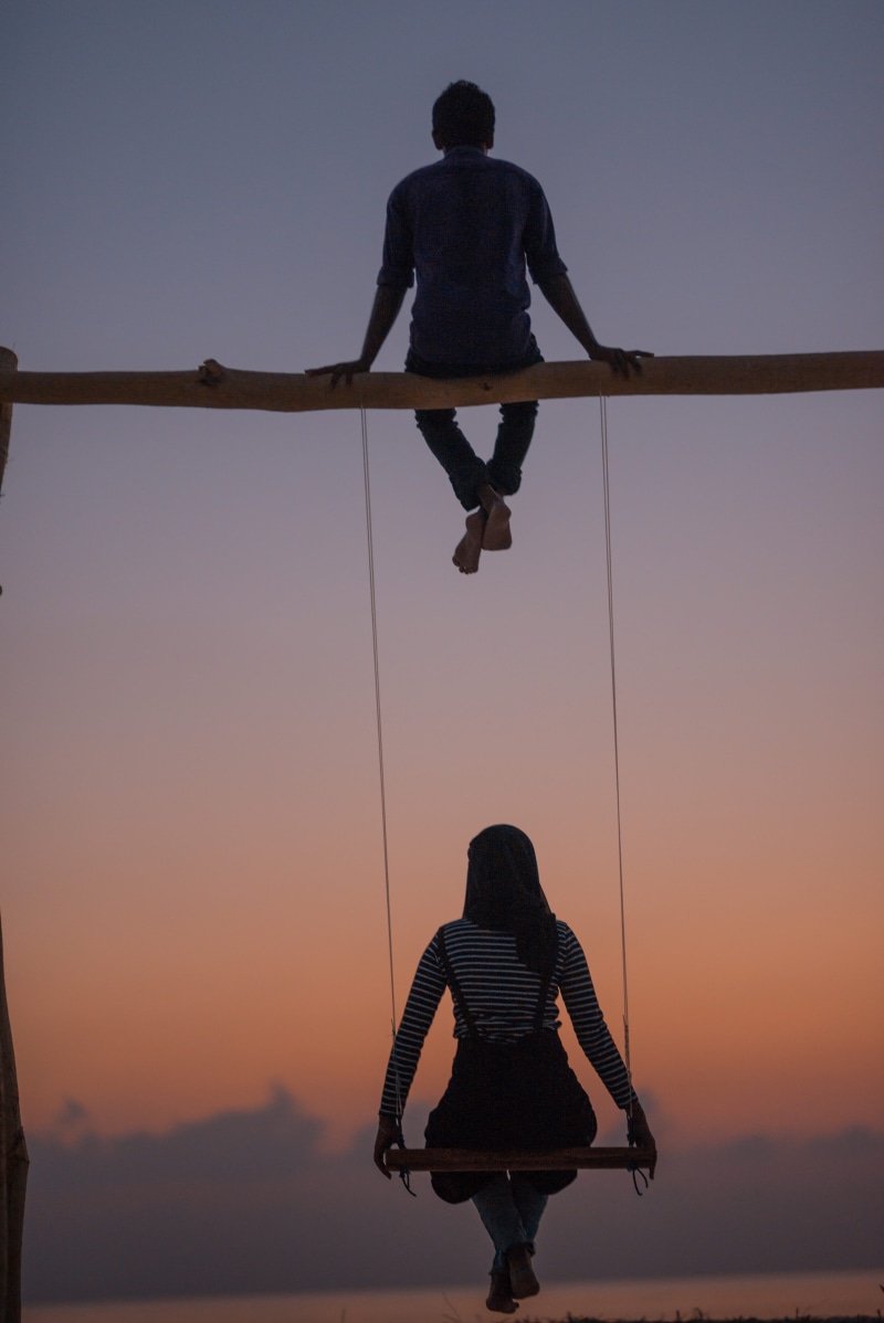 adventure, sky, real people, full length, silhouette, man, dusk, lifestyles, human, pants, female, balance, one person, clear sky, sunset, back, outdoors
