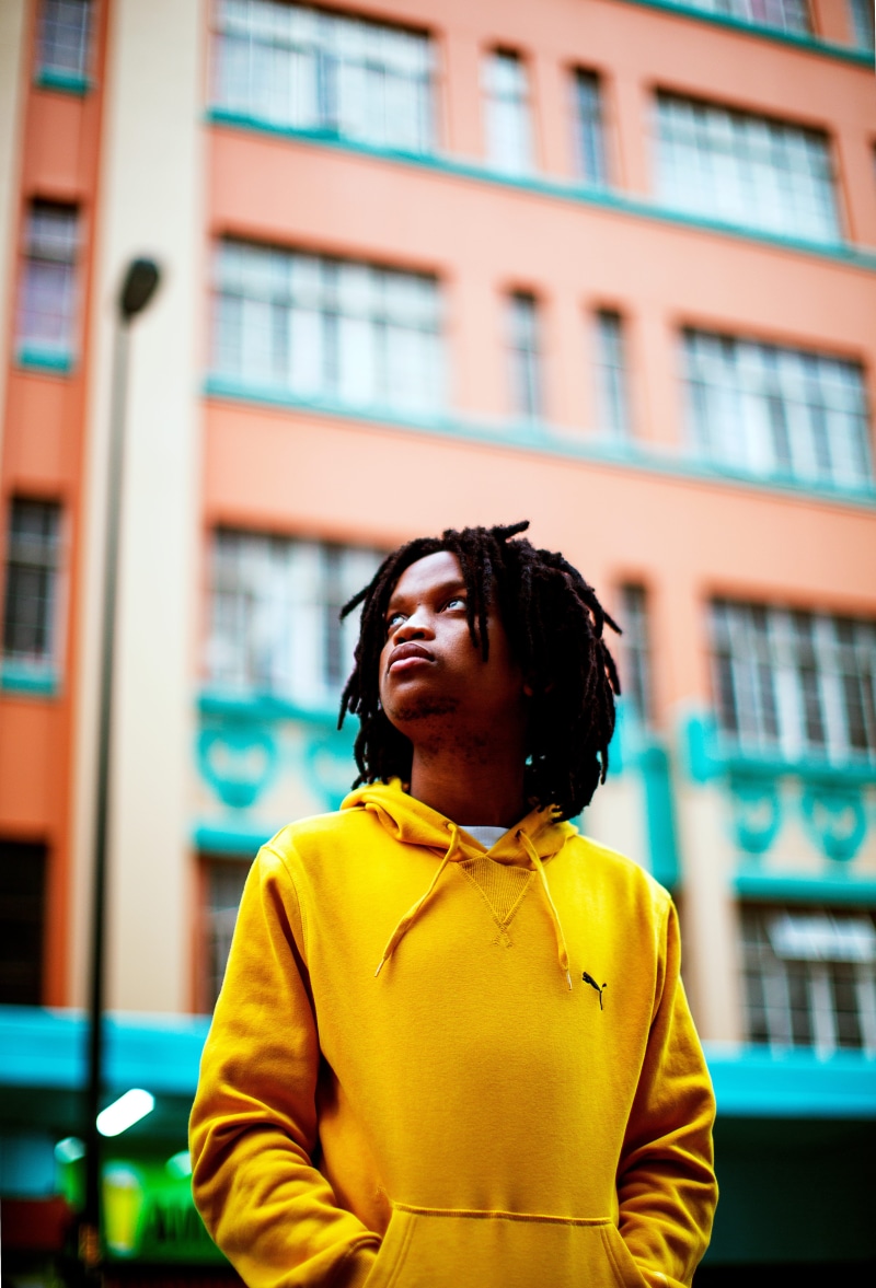 young adult, 33 maud mfusi, selfie, building exterior, contemplation, person, built structure, looking, sleeve, real people, one person, portrait, city