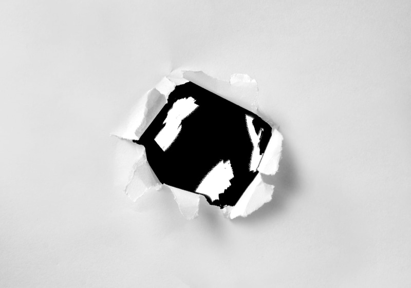 tear, indoors, damaged, shape, breaking, broken, white background, white color, copy space, destruction, sign, close-up, ruined, texture, aggression, wall