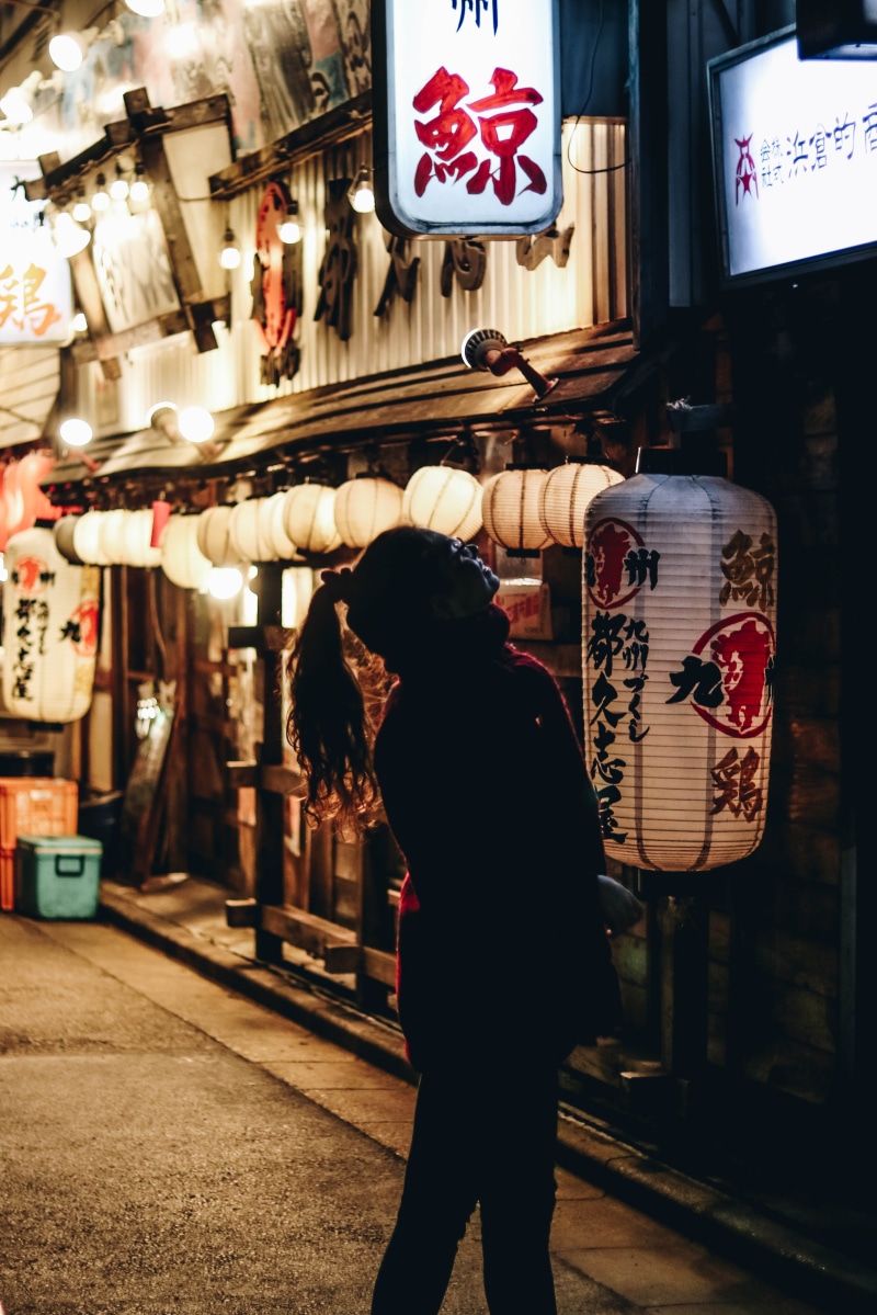 casual clothing, real people, street, china town, chinese culture, architecture, standing, paper, chinese writing, leisure activity, beside, text, lantern