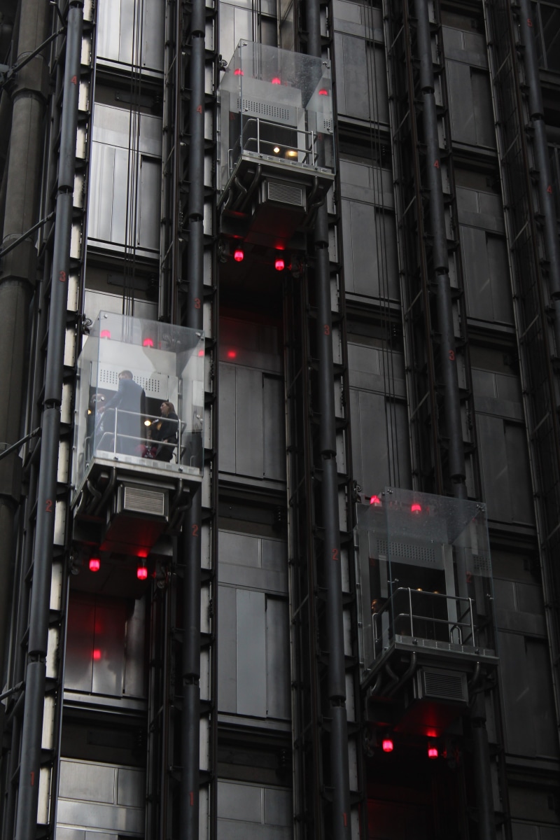 city, built structure, light, full frame, modern, building exterior, uk, safety, red, elevator, low angle view, location, lighting equipment, sign, day