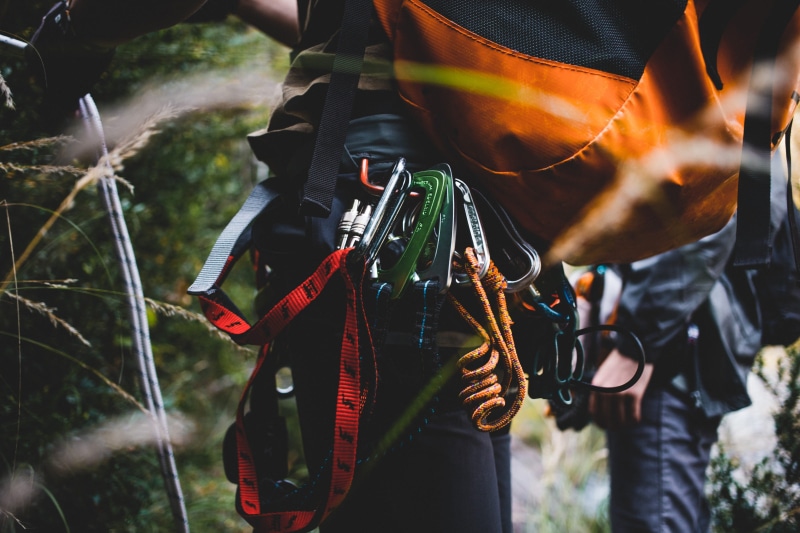 men, trekking, midsection, scale, holding, safety, helmet, male, carabiner, perilous, nature, challenge, strong, climbing, real people, young, rock climbing