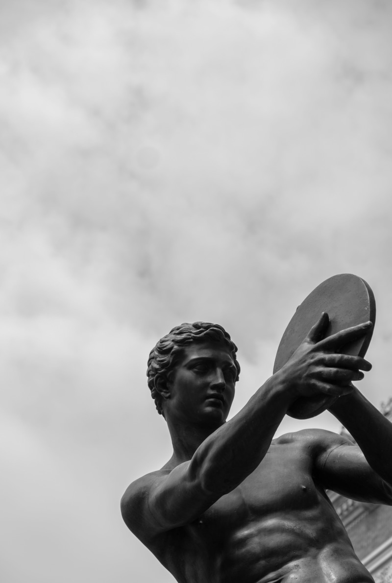 statue, one person, black and white, young adult, contemplation, greek, shirtless, art and craft, outdoors, culture, art, low angle view, men, sky, sculpture