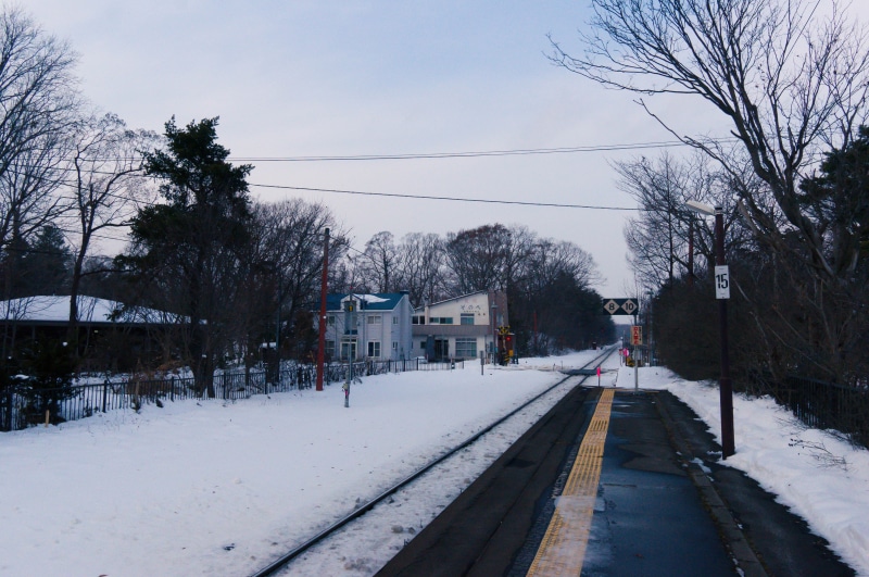 snow, covering, no people, built structure, rail transportation, building, winter, railroad track, diminishing perspective, street view, plant, brown, Japan