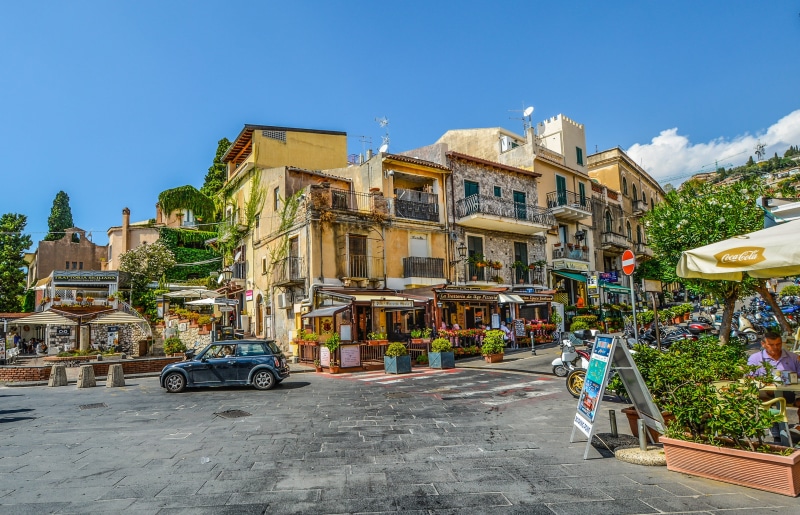 mediterranean, town, street, store, architecture, City, building exterior, Cafe, nature, built structure, land vehicle, blue, motor vehicle, travel Destinations