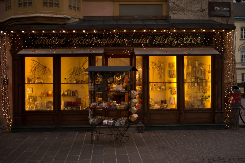 display, 5K, food, front, outdoors, store, business, no people, candlemaker, retail, street, glass, innsbruck, building, christmas lights, shop window