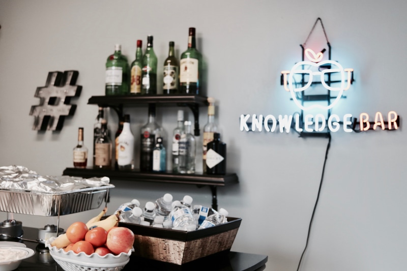 sign, signage, bottle, celebration, indoors, group of Objects, booze, shelf, inbound, design, light, variation, workplace, work, bar, office, lighted, wall