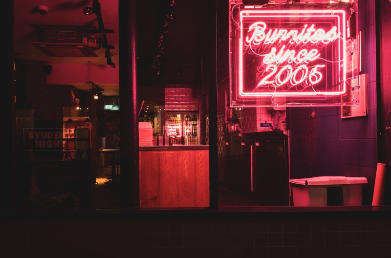 bar counter, dish, cafe, food, night club, lighting, signage, club, burritos, store, cafeteria, script, sign, western script, communication, business, shop