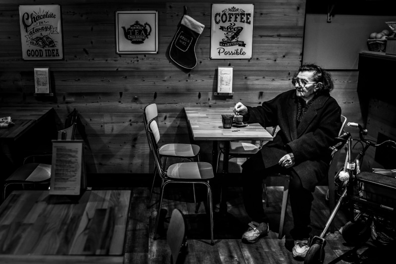 dining table, seat, shoe, food, tabletop, clothing, business, one person, males, real people, men, furniture, communication, cafeteria, lifestyles, meal