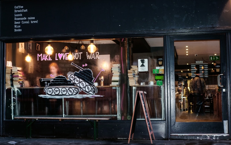 apparel, book, bar - drink establishment, sign, boutique, neon, reflection, store, business, city, deli, communication, shop, non-western script, cafe