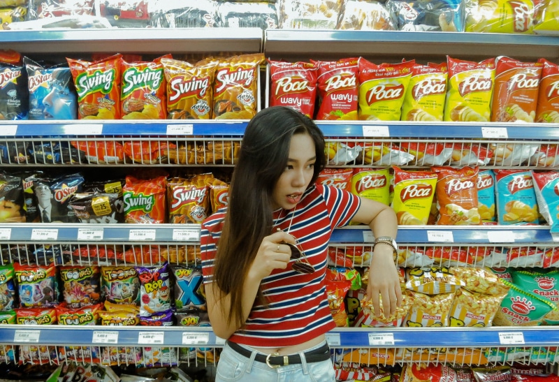 variation, bazaar, food and drink, shop, store, can, retail display, human, standing, buying, clothing, hairstyle, one person, aluminium, order, food, groceries