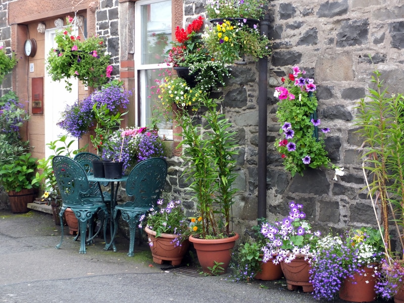 no people, pots, cottage, outdoors, structure, home, nature, color, brick, assorted, chairs, petaled, vulnerability, choice, flowering plant, building exterior