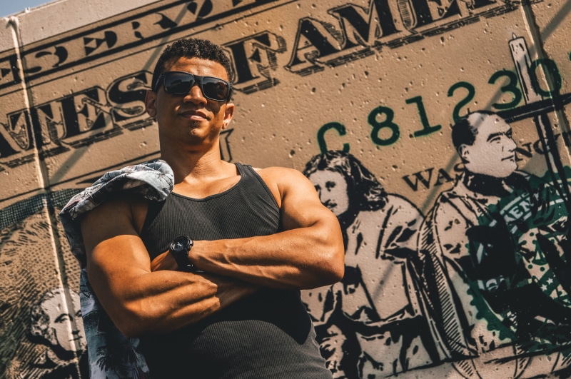 summer, architecture, wall, day, wall - building feature, glasses, looking, wear, graffiti, person, smiling, text, lifestyles, young adult, communication