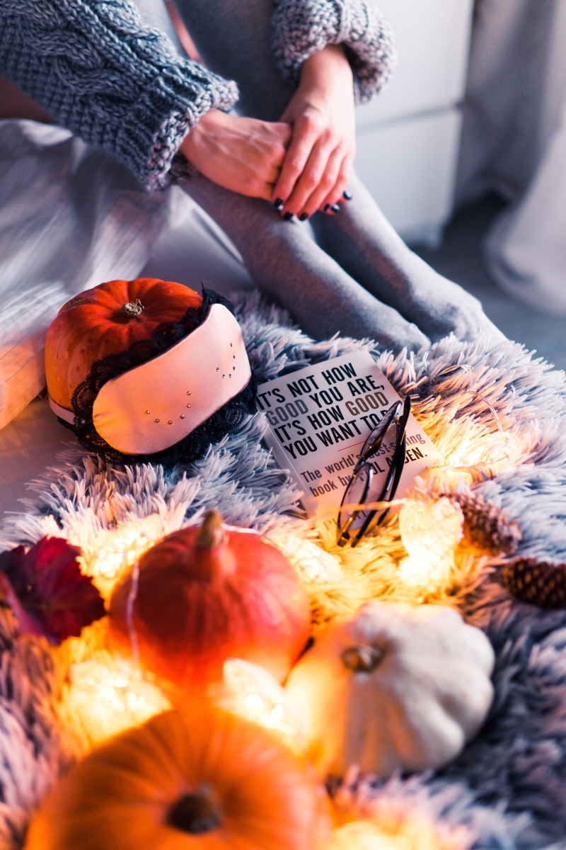 midsection, lights, halloween, top, hands, happy halloween, one person, home, book, relax, selective focus, close-up, fashion, books, orange color, evening