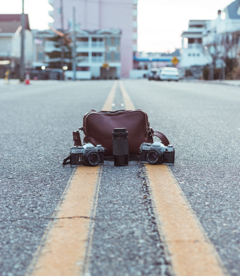 selective focus, vintage, mode of transportation, united states, film camera, sunset, canon, middle of the street, lens, building exterior, motor vehicle